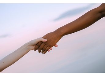 Two friends holding hands